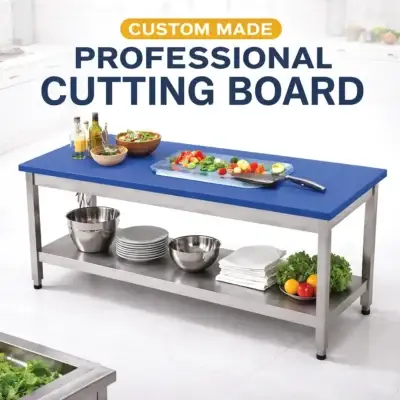 Polyethylene cutting board with stainless steel table for commercial kitchen food preparation.