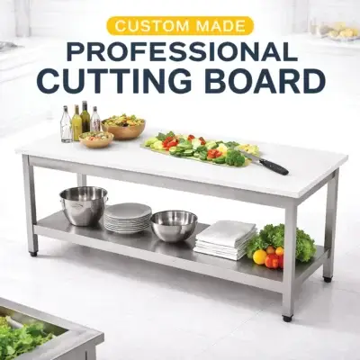 White polyethylene cutting board with stainless steel table for commercial kitchen food preparation.